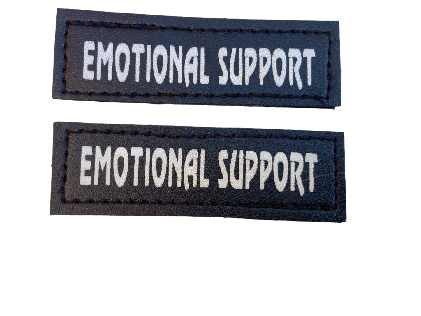 Two black rectangular patches with 'EMOTIONAL SUPPORT' text on a light gray background