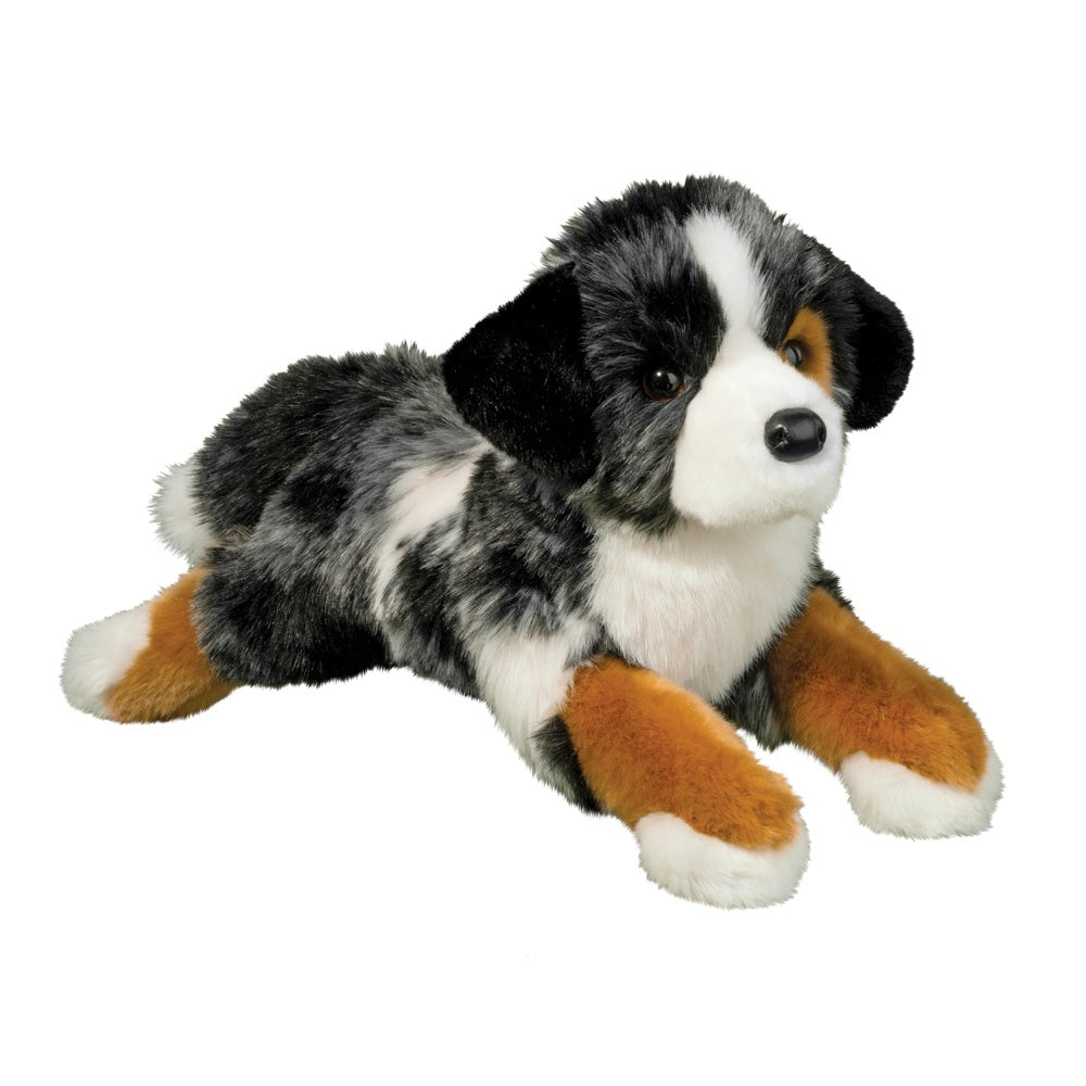 Plush emotional support toy dog with black, white, and brown fur on a white background