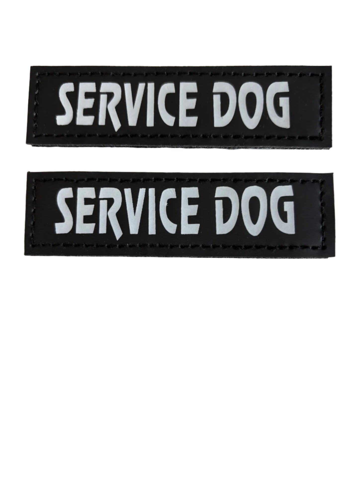 Two black rectangular patches with 'SERVICE DOG' text on a white background