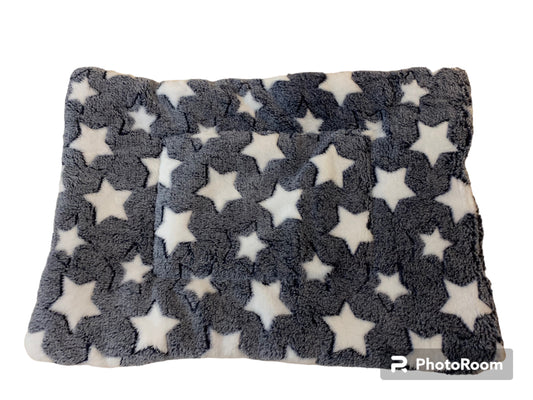 Flannel blanket with star pattern on a white background